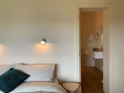 Letto o letti in una camera di Casa Cedro - Il Brolo Holiday Homes