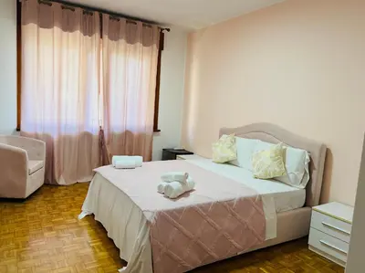 Letto o letti in una camera di First Dream Mestre