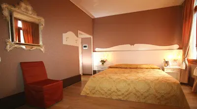 Letto o letti in una camera di Hotel Corte dei Greci
