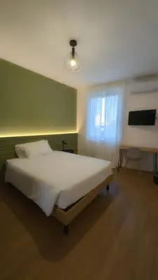 Letto o letti in una camera di Pilo2Home