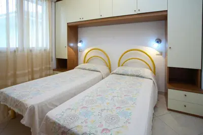 Letto o letti in una camera di Elsa 2 camere da letto vista spiaggia