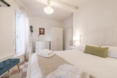 Letto o letti in una camera di Santa Lucia Canal View by Wonderful Italy