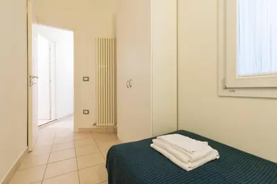 Letto o letti in una camera di enJoy Home - Appartamento Carducci
