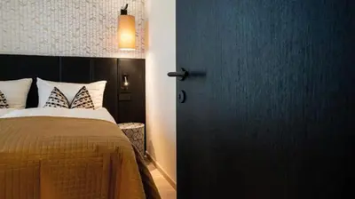 Letto o letti in una camera di Relais Santa Lucia - Appartamenti Superior e Deluxe