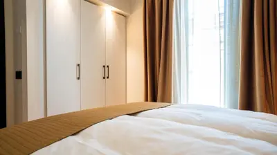Letto o letti in una camera di Relais Santa Lucia - Appartamenti Superior e Deluxe