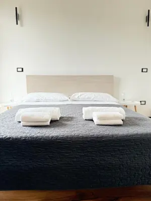 Letto o letti in una camera di Infinity House - Eleganza Moderna tra Treviso e Venezia