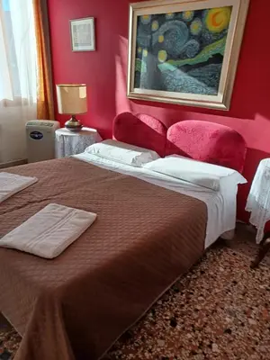 Letto o letti in una camera di Residence Fortuny Princessclass
