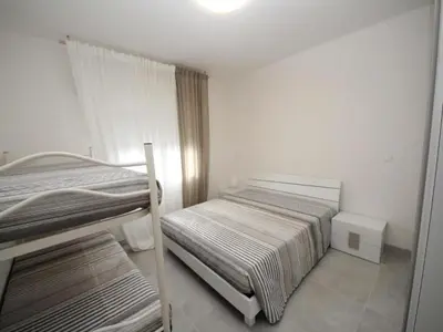 Letto o letti in una camera di Spacious flat in Rosolina for your holiday