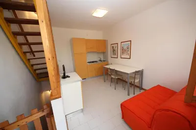 Cucina o angolo cottura di Relax in our flat with garden in Rosolina