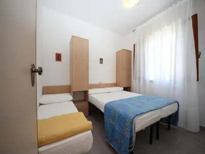 Letto o letti in una camera di Comfortable beachside apartment in Rosolina