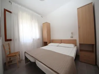 Letto o letti in una camera di Comfortable beachside apartment in Rosolina