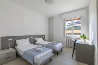 Letto o letti in una camera di Ca' Milla 2 by WelcHome