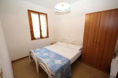 Letto o letti in una camera di Functional flat in a peaceful area of Rosolina