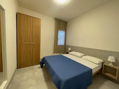 Letto o letti in una camera di Modern two bedroom apartment near Rosolina beach
