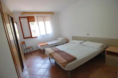 Letto o letti in una camera di Cozy flat in Rosolina