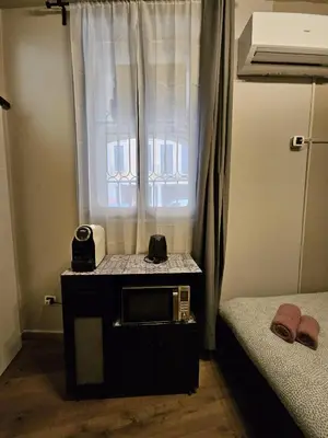 Letto o letti in una camera di Zen Apartments Belzoni