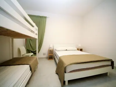 Letto o letti in una camera di Modern apartment near the beach