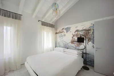 Letto o letti in una camera di Maison sul Pozzo, Venicevillas
