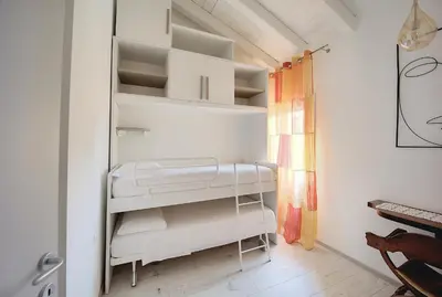 Letto o letti in una camera di Maison sul Pozzo, Venicevillas