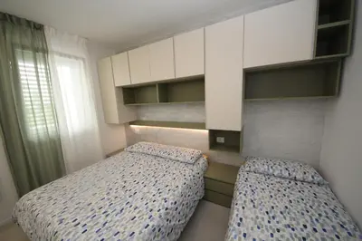 Letto o letti in una camera di Modern apartment in renovated residence in Rosolina