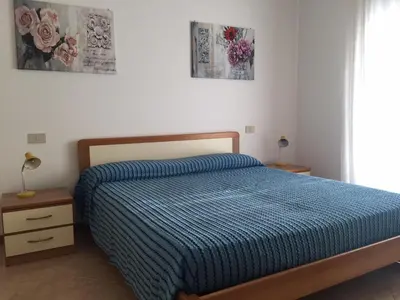 Letto o letti in una camera di Due camere, vicino al mare - CONDOMINIO OLIMPIA