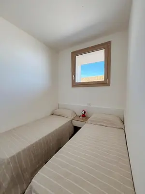 Letto o letti in una camera di Athesis Lodges