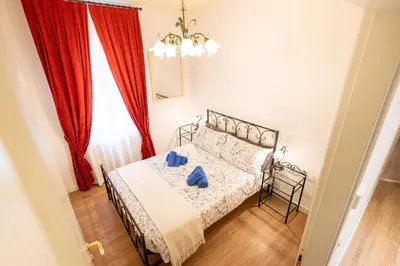 Letto o letti in una camera di Vista Canale, 4 ospiti, 2 camere e 2 bagni