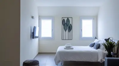 Letto o letti in una camera di Erïk Langer Pedrocchi Suites