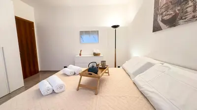 Letto o letti in una camera di Casa Micio by Ca-Sa Check