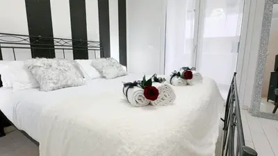 Letto o letti in una camera di Casa Helios by Ca-Sa Check
