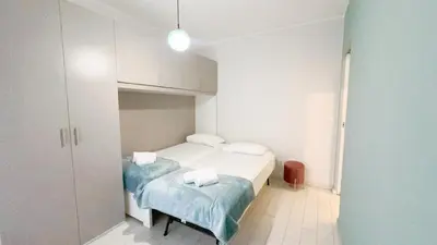 Letto o letti in una camera di Casa Helios by Ca-Sa Check