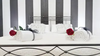 Letto o letti in una camera di Casa Helios by Ca-Sa Check