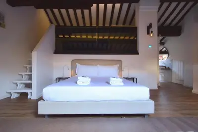 Letto o letti in una camera di Welc-ōM Padova Piazze