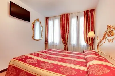 Letto o letti in una camera di Heart of Biennale