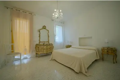 Letto o letti in una camera di Affittacamere Ca' Cini