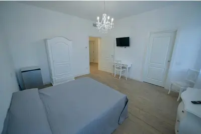 Letto o letti in una camera di Affittacamere Ca' Cini