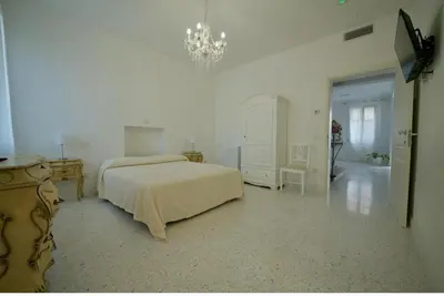 Letto o letti in una camera di Affittacamere Ca' Cini