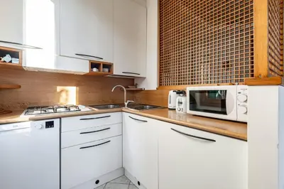 Cucina o angolo cottura di GuestHost - Cozy 2-Bedroom Stay at Lido di Venezia