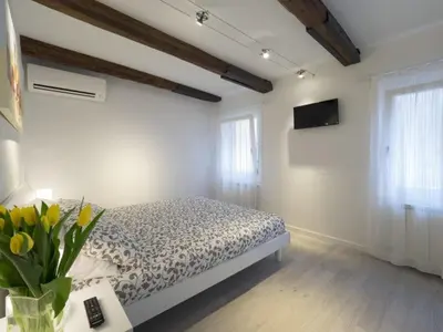 Letto o letti in una camera di Ca' dei Scorsoni Apartments