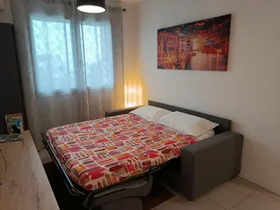 Letto o letti in una camera di Appartamento ROVERE