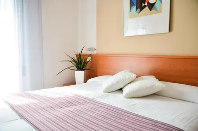 Letto o letti in una camera di Hotel Domingo