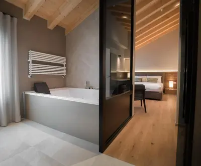Letto o letti in una camera di Agriturismo Prà dell'Ort - Wishing Wellness