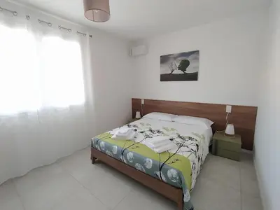 Letto o letti in una camera di Appartamento GINEPRO