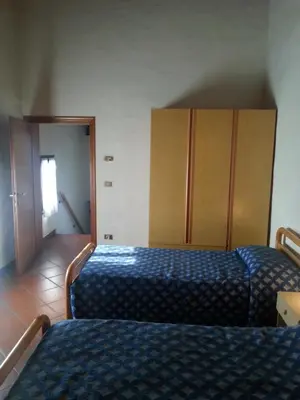 Letto o letti in una camera di Casarosa B&B