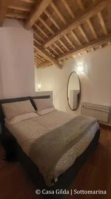 Letto o letti in una camera di Casa Gilda