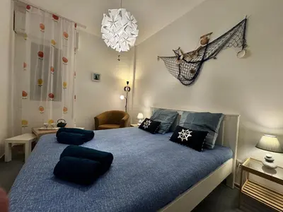 Letto o letti in una camera di Casa Angela by Ca-Sa Check