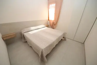 Letto o letti in una camera di Renovated two bedroom flat in Rosolina Mare