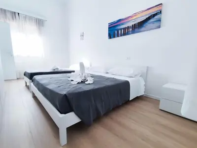 Letto o letti in una camera di Ariston Superior Fronte Mare