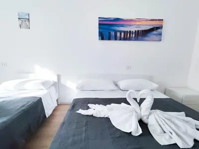 Letto o letti in una camera di Ariston Superior Fronte Mare