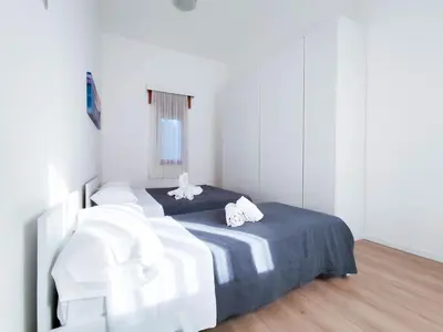 Letto o letti in una camera di Ariston Superior Fronte Mare